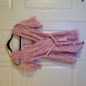 Francesca's pink lace romper long sleeve and shorts with belt and ties in back